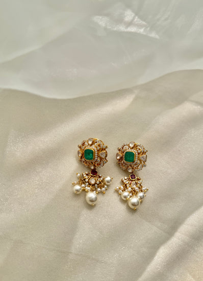 Sonia Earrings featuring green rectangular centres, red accents, clear-stone detailing and dangling white beads
