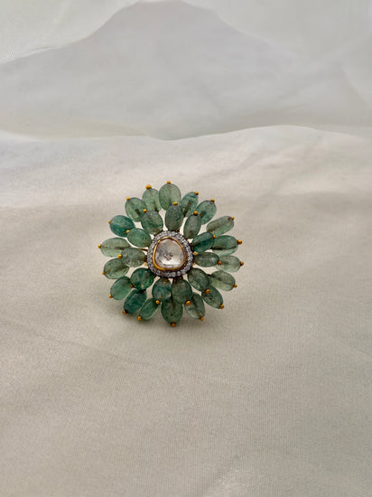 Trisha Ring featuring green oval beads arranged in a floral design around a clear triangular centre.