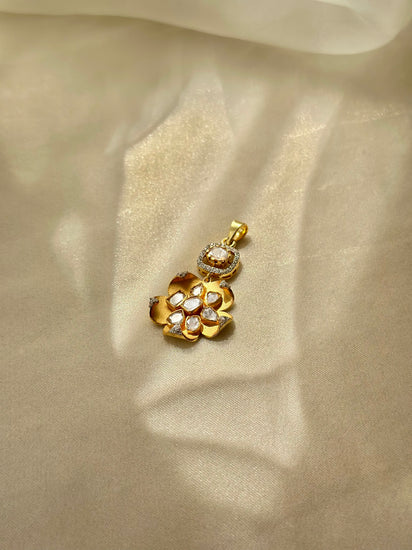 Kusum Polki Pendant featuring sculpted gold-tone flower petals and clustered clear stones beneath a stone-set bail.