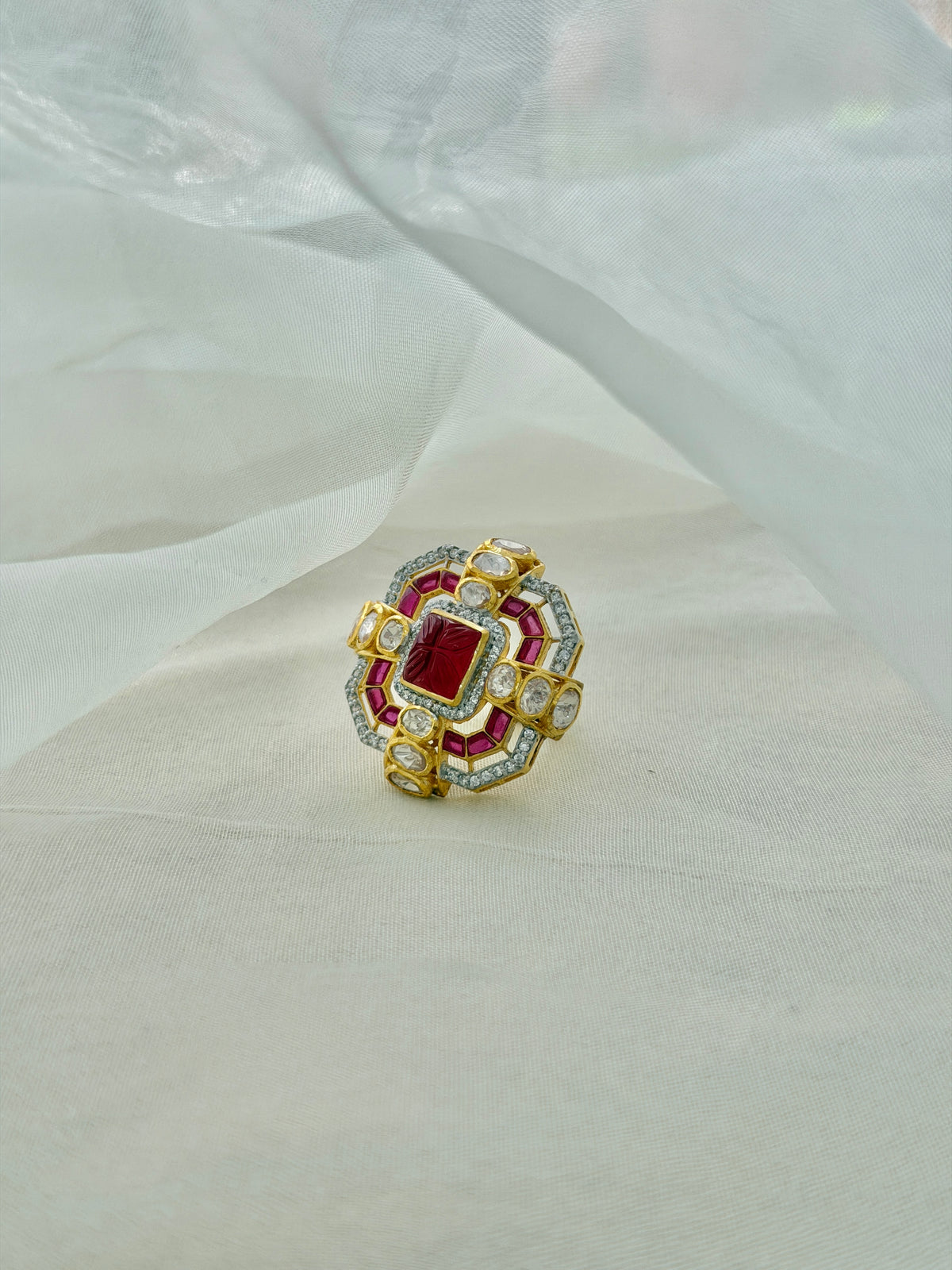 Durbar Ring featuring a rectangular red centre with geometric pink accents and clear-stone detailing in a gold-tone setting.