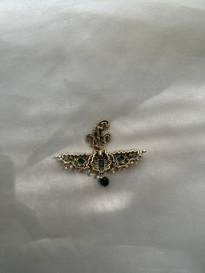 Huzoor Sarpech featuring a curved green plume, clear-stone detailing, white bead fringe and a dangling green bead.