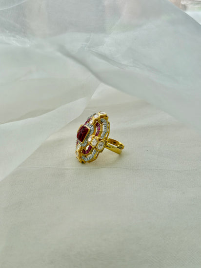 Durbar Ring featuring a rectangular red centre with geometric pink accents and clear-stone detailing in a gold-tone setting.