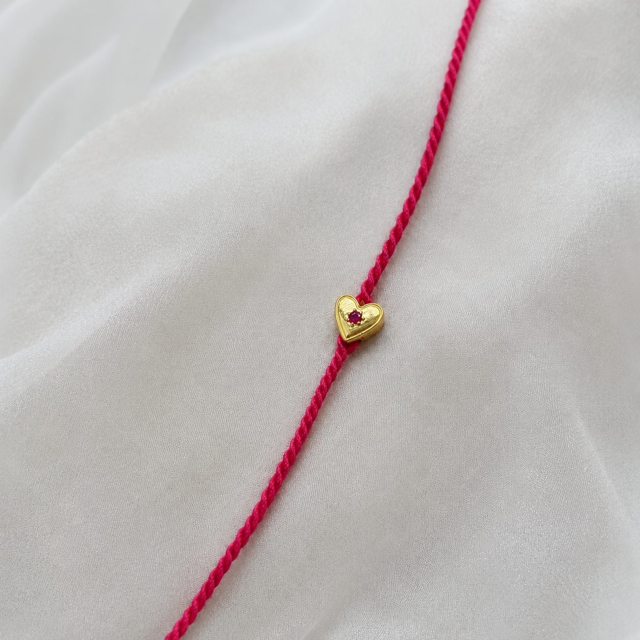 Heart Ruby Rakhi in 92.5 fine silver with ruby gemstone – Eterno India