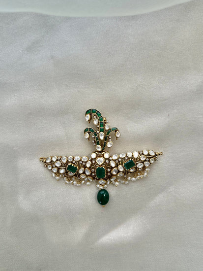 Huzoor Sarpech featuring a curved green plume, clear-stone detailing, white bead fringe and a dangling green bead.