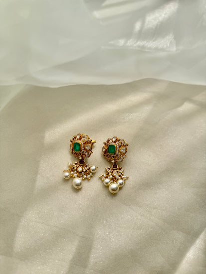 Sonia Earrings featuring green rectangular centres, red accents, clear-stone detailing and dangling white beads